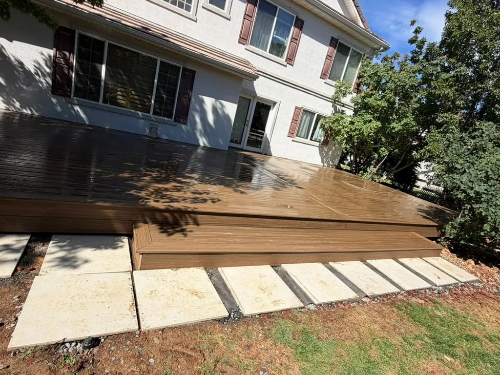 Composite deck with wide step and concrete stepping pads