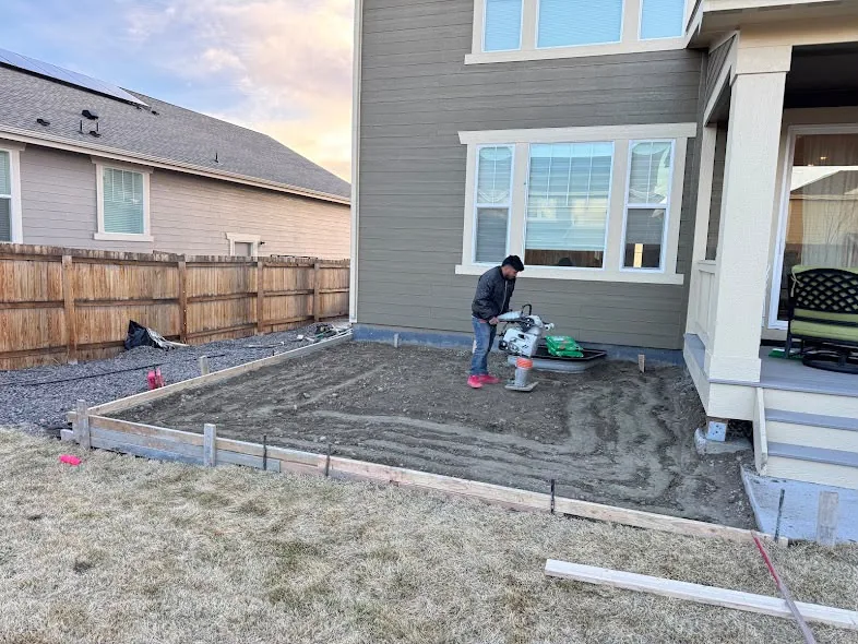 Compacting the base before pouring a concrete patio